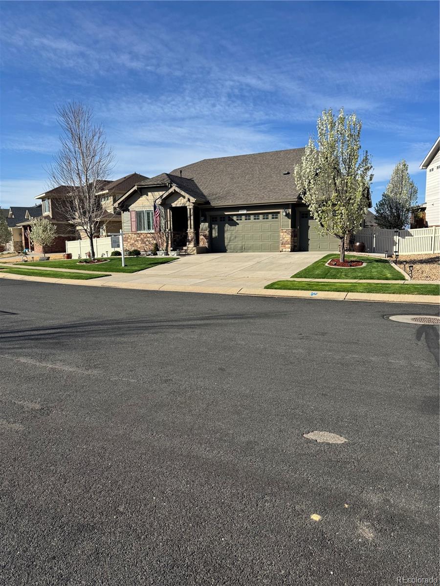 8841 Peakview Avenue Firestone, CO 80504 - Photo 40 of 40 a front view of a house with a yard