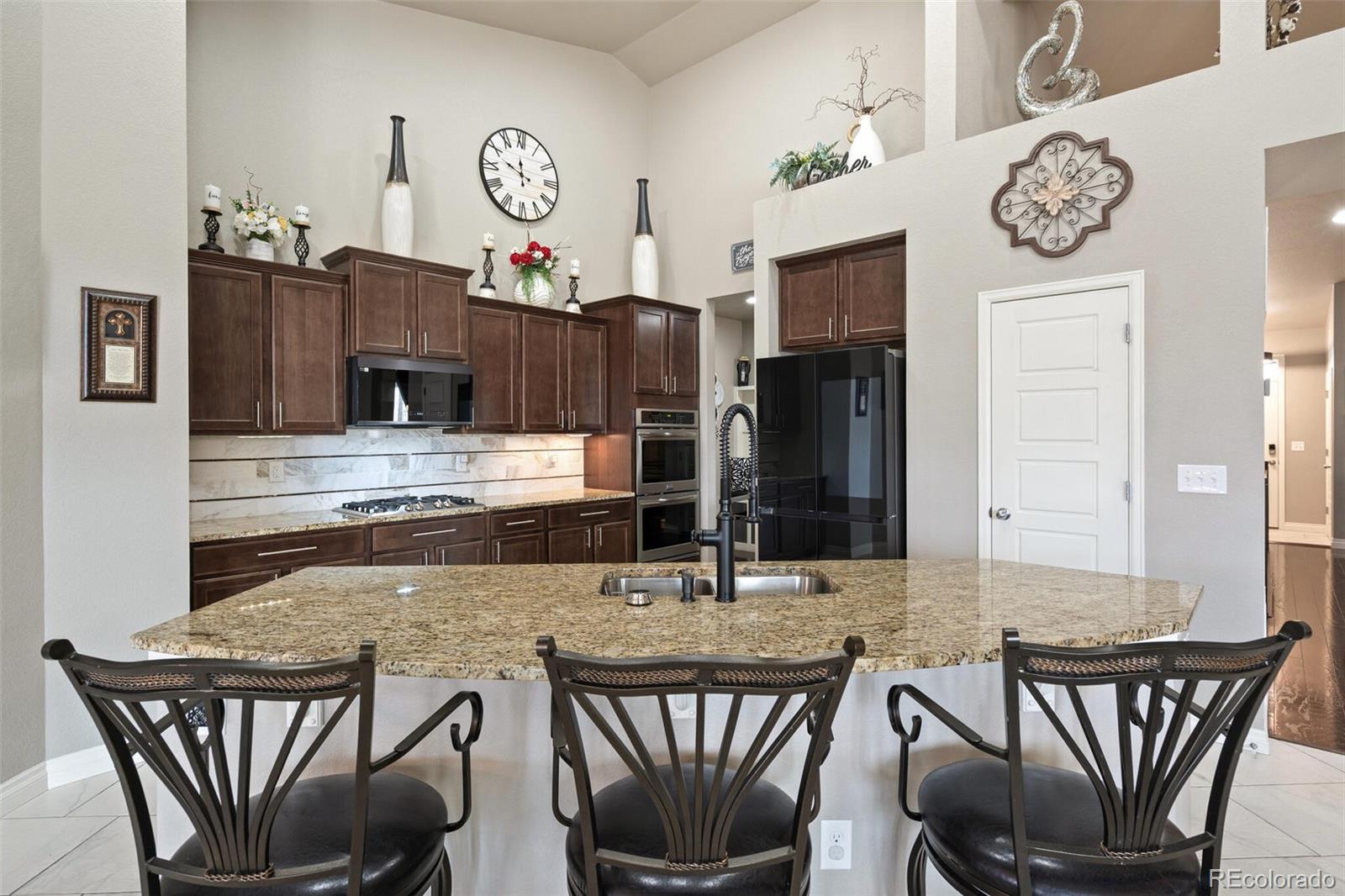 8841 Peakview Avenue Firestone, CO 80504 - Photo 6 of 40 a view of a dining room with furniture