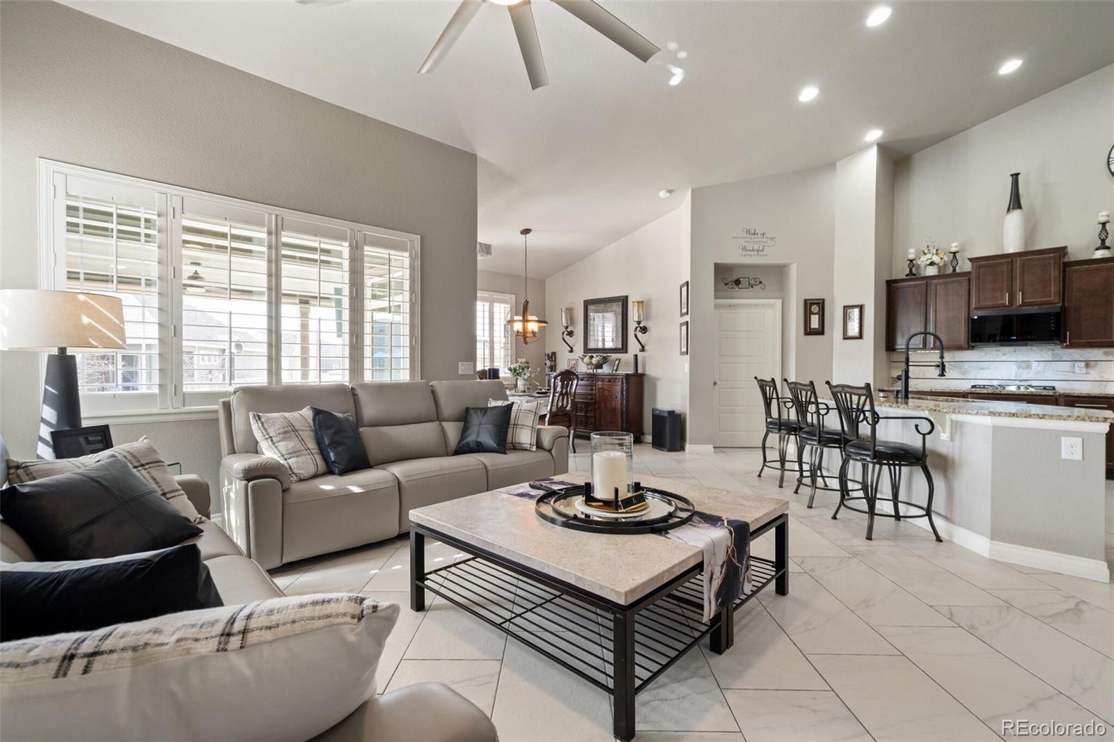8841 Peakview Avenue Firestone, CO 80504 - Photo 10 of 40 a living room with furniture and kitchen view