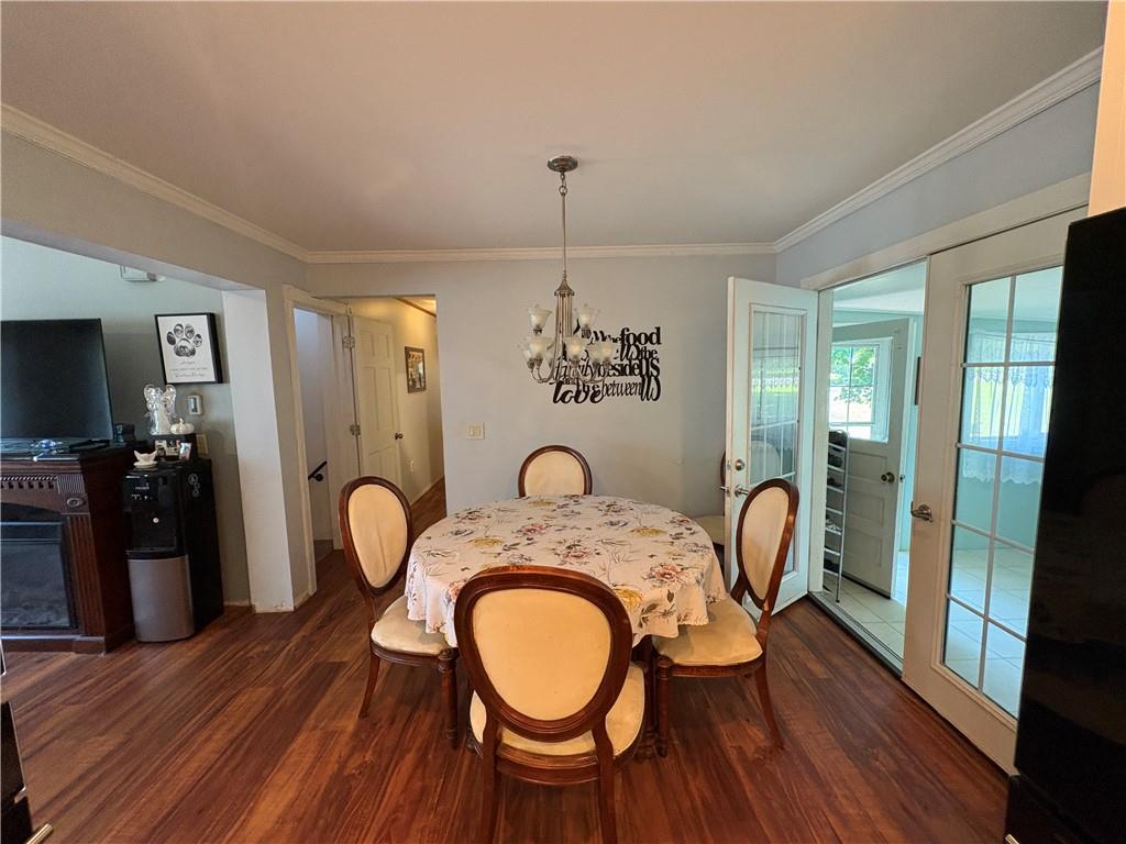 94 Middle Road Reynoldsville, PA 15851 - Photo 12 of 36 a dining room with furniture a chandelier and wooden floor