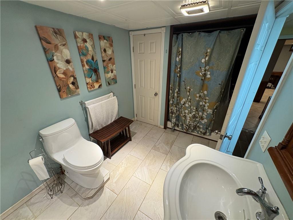 94 Middle Road Reynoldsville, PA 15851 - Photo 34 of 36 a bathroom with a toilet sink and shower