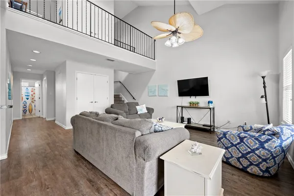 a view of a dining room with furniture and wooden floor