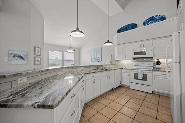 a view of a two chairs in the balcony