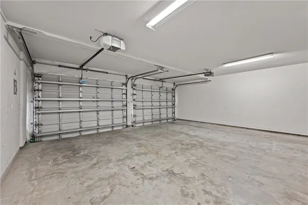 a view of a livingroom with furniture and a ceiling fan