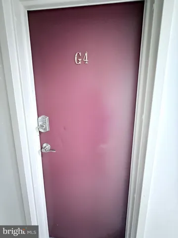 a view of a kitchen with a sink stove cabinets and empty room