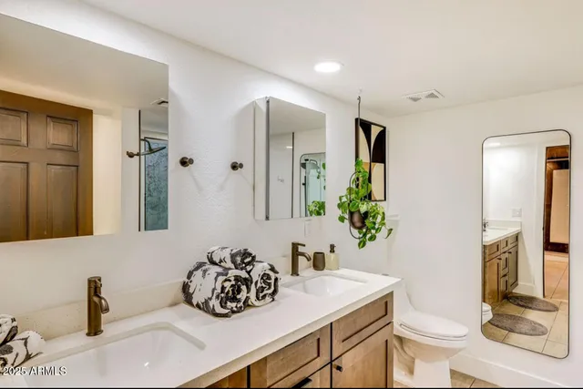 a bathroom with a shower and a glass door
