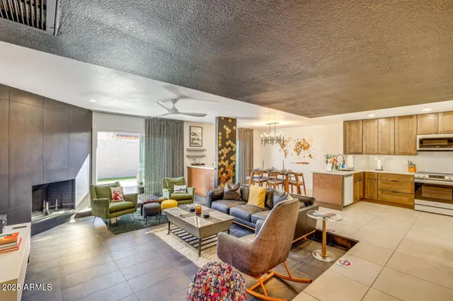 a living room with furniture and fireplace