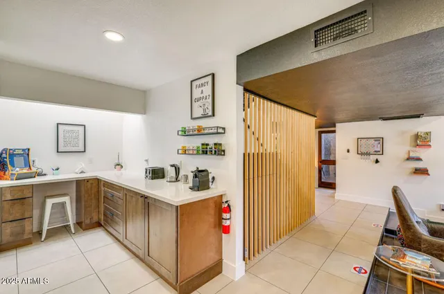 a kitchen with granite countertop appliances cabinets and a sink