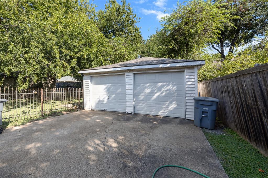 6317 Ravendale Lane Dallas, TX 75214 - Photo 16 of 16 front view of a house with a garage