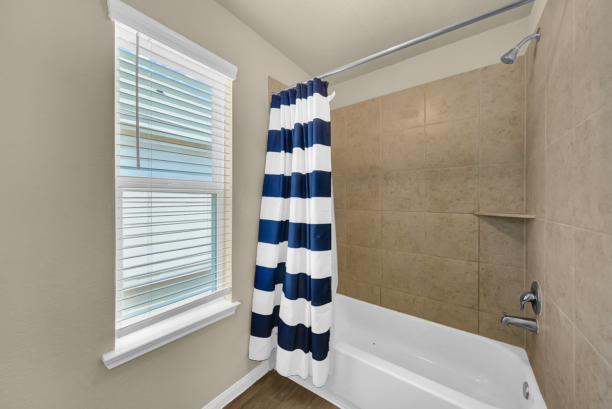 4274 McGregor Blf Lane Conroe, TX 77304 - Photo 14 of 25 a bathroom with a bathtub and a shower