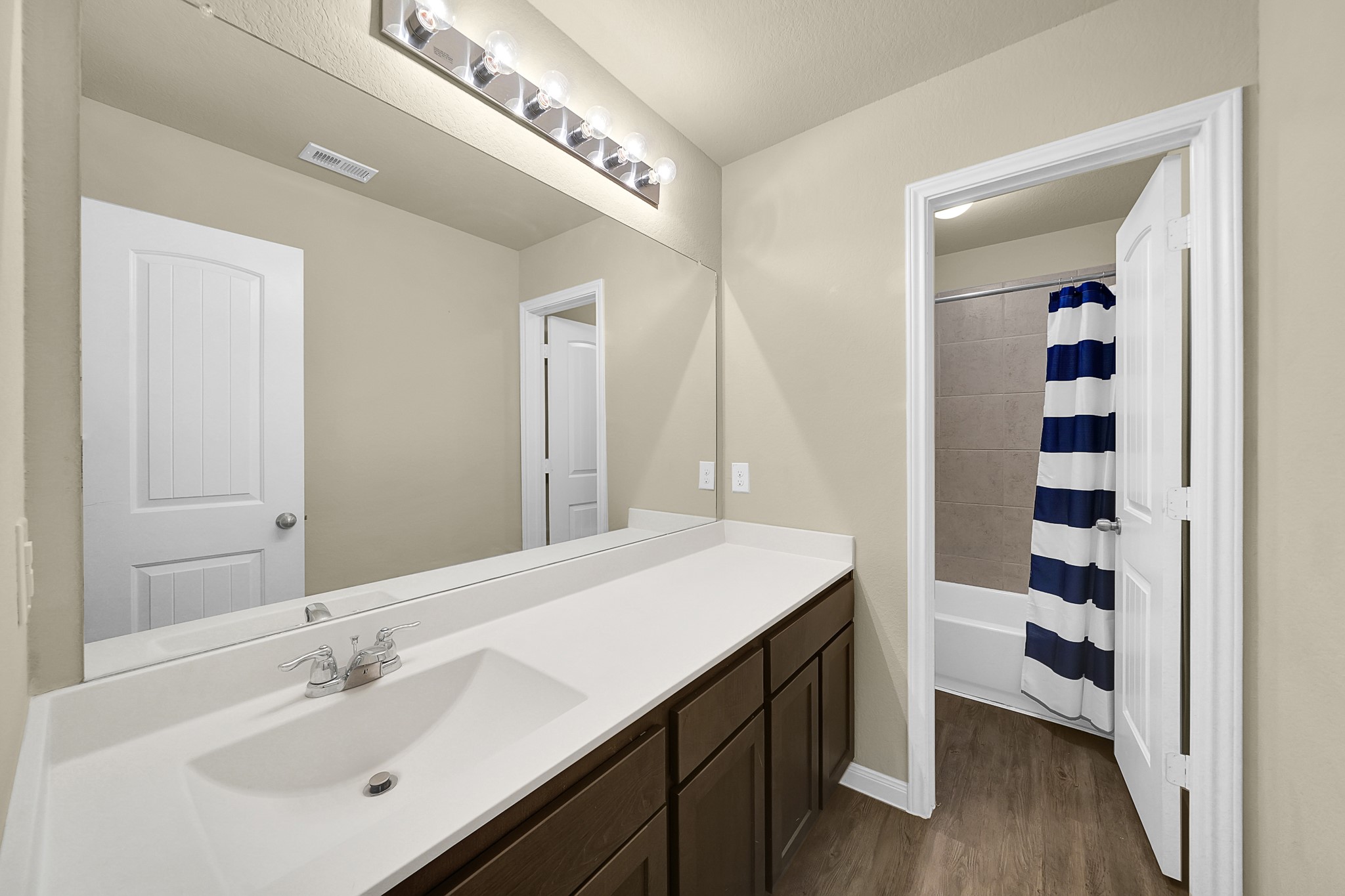 4274 McGregor Blf Lane Conroe, TX 77304 - Photo 16 of 25 a bathroom with a sink a toilet and shower