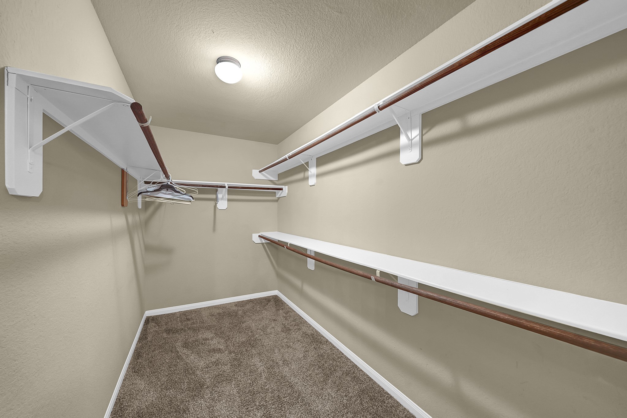 4274 McGregor Blf Lane Conroe, TX 77304 - Photo 17 of 25 a view of a room with racks on the wall