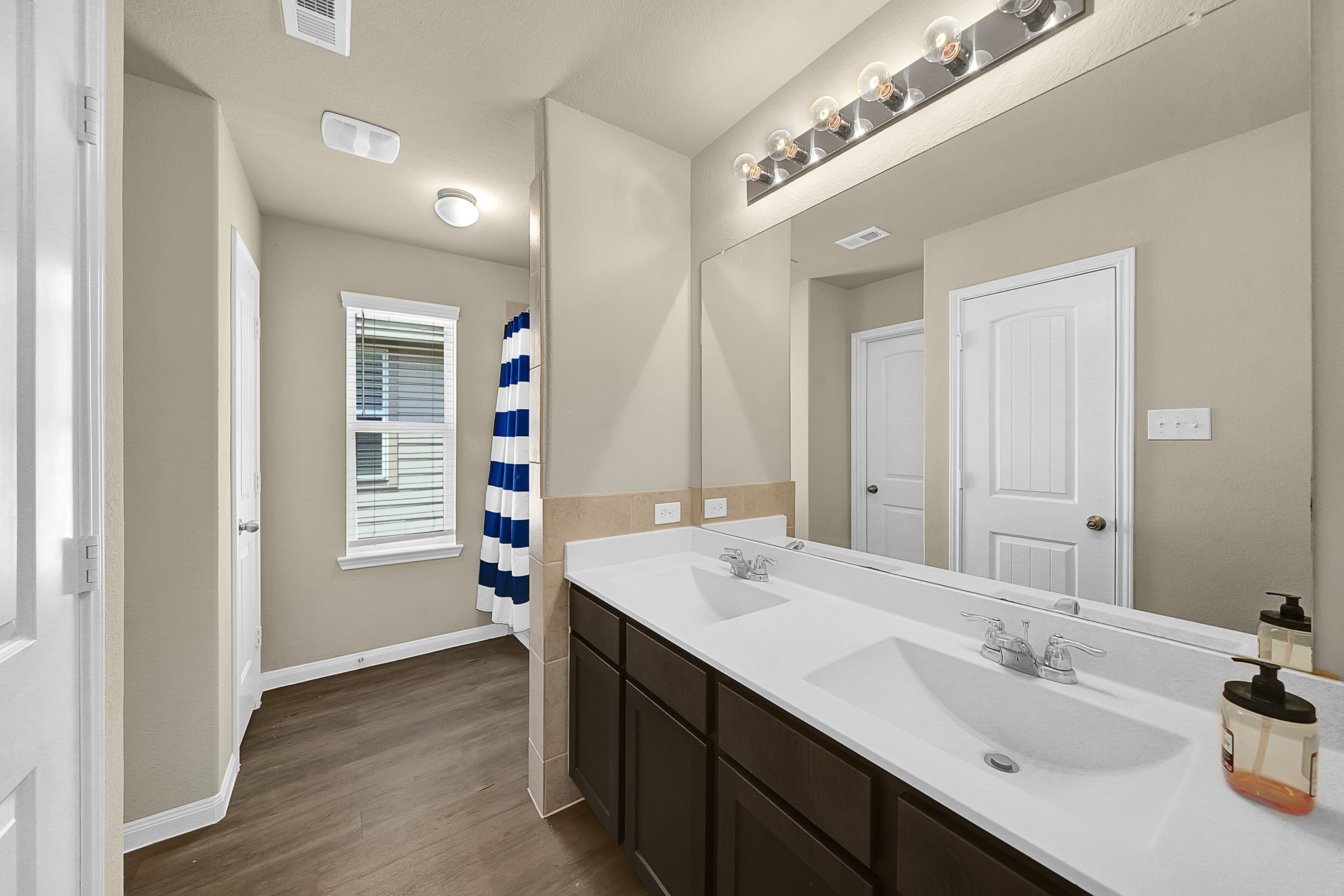 4274 McGregor Blf Lane Conroe, TX 77304 - Photo 18 of 25 a bathroom with a sink double vanity and a mirror