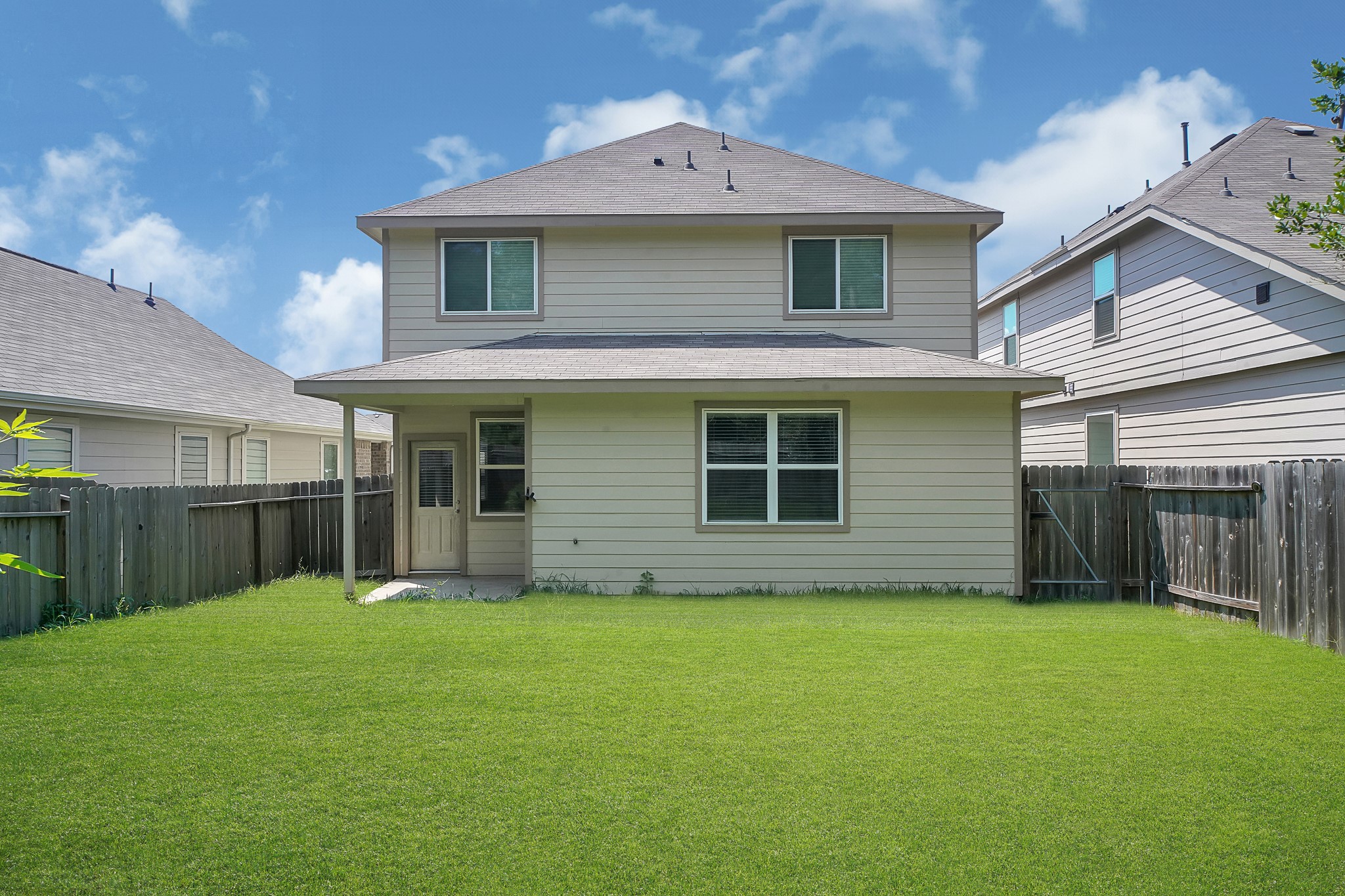 4274 McGregor Blf Lane Conroe, TX 77304 - Photo 24 of 25 a front view of a house with a yard and garage