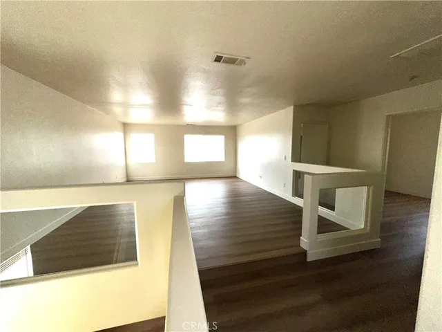 a view of an entryway and kitchen