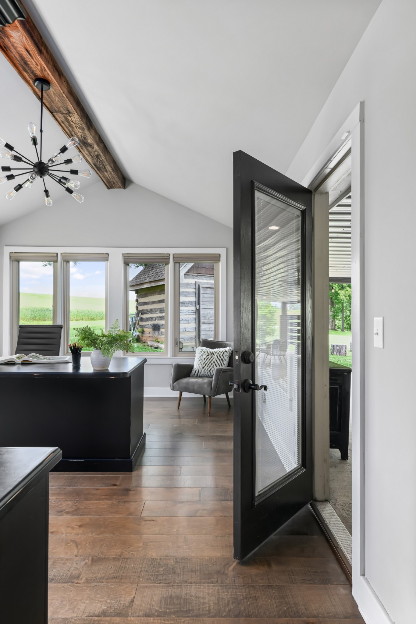 6557 Lamont Road Springfield, TN 37172 - Photo 17 of 62 a living room with furniture large window and wooden floor