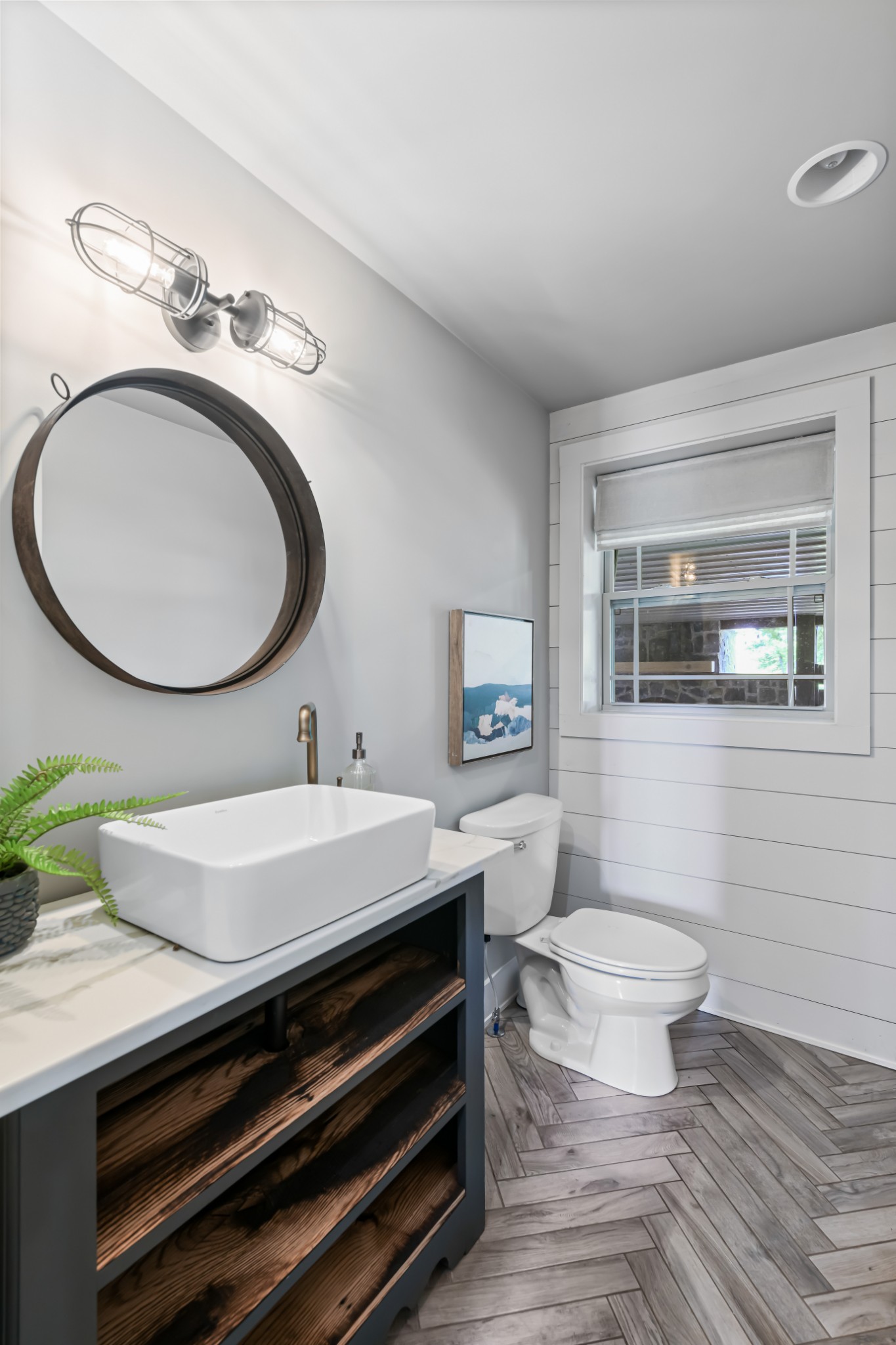6557 Lamont Road Springfield, TN 37172 - Photo 26 of 62 a bathroom with a toilet a sink and mirror