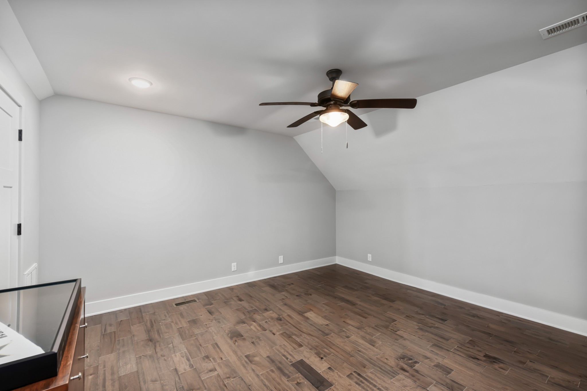 6557 Lamont Road Springfield, TN 37172 - Photo 27 of 62 a view of a room with wooden floor and a ceiling fan