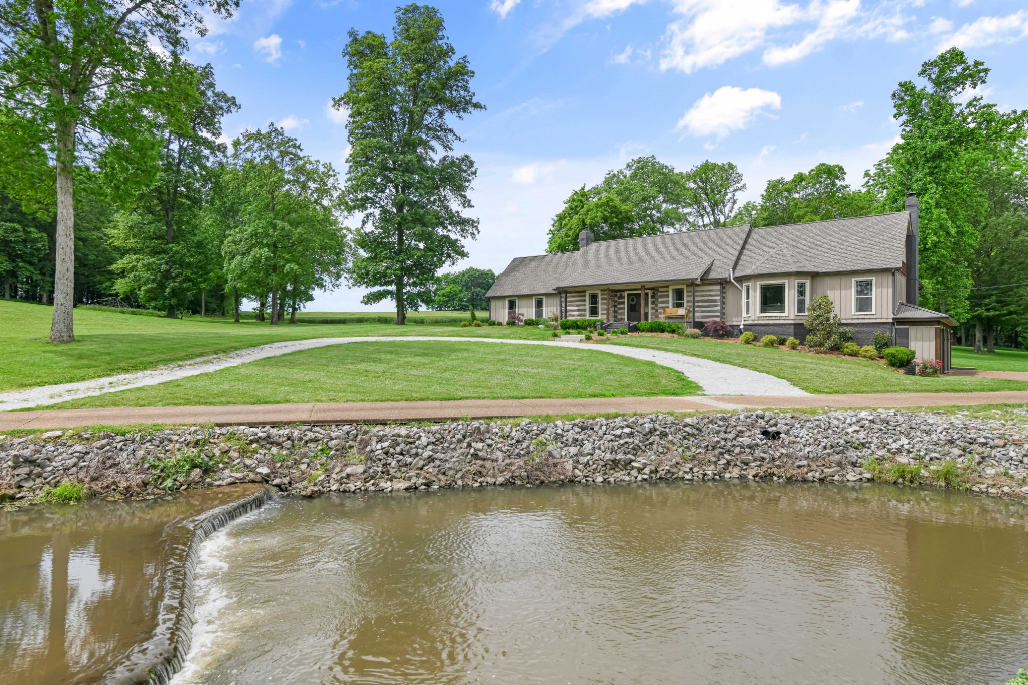 6557 Lamont Road Springfield, TN 37172 - Photo 34 of 62 a view of a house with a yard and a lake view