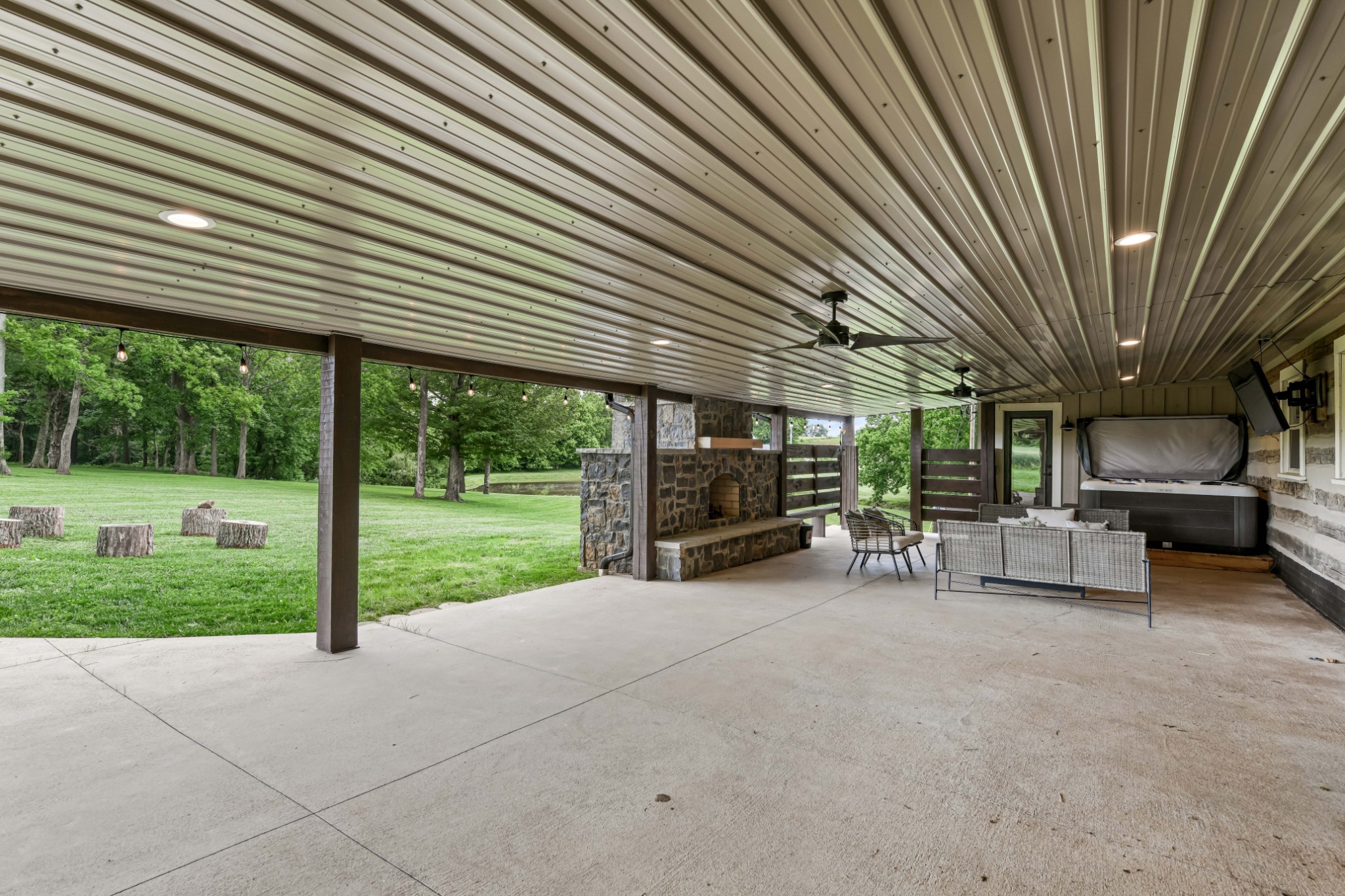 6557 Lamont Road Springfield, TN 37172 - Photo 54 of 62 a view of a patio with table and chairs and a large tree