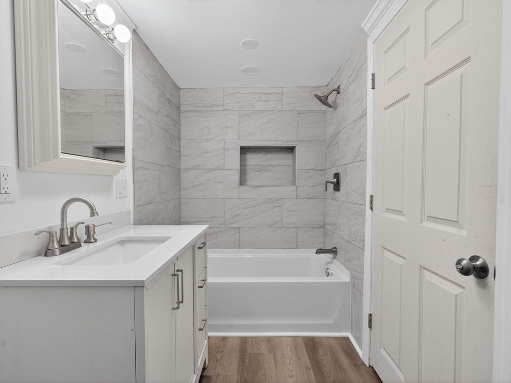 44 Liberty Street Randolph, MA 02368 - Photo 14 of 41 a bathroom with a sink and a bathtub