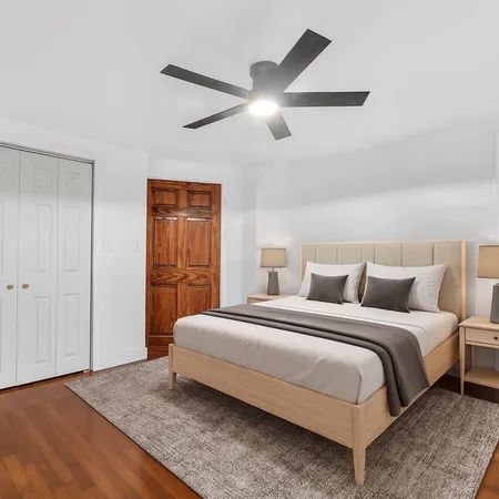 a bedroom with a bed and closet