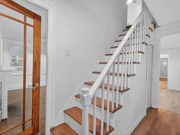 a view of entryway with wooden floor