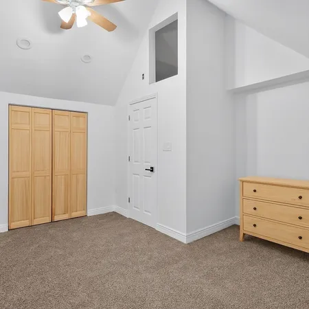 an empty room with a empty space and windows