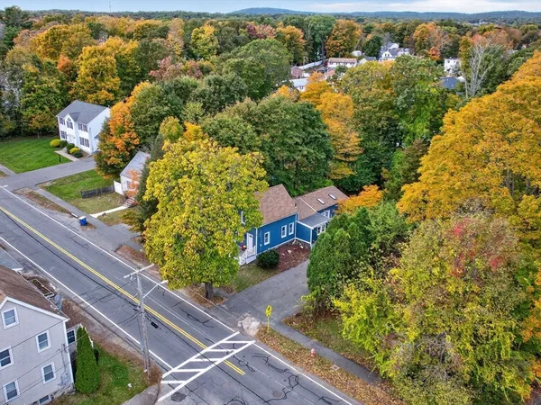 an aerial view of residential houses with outdoor space