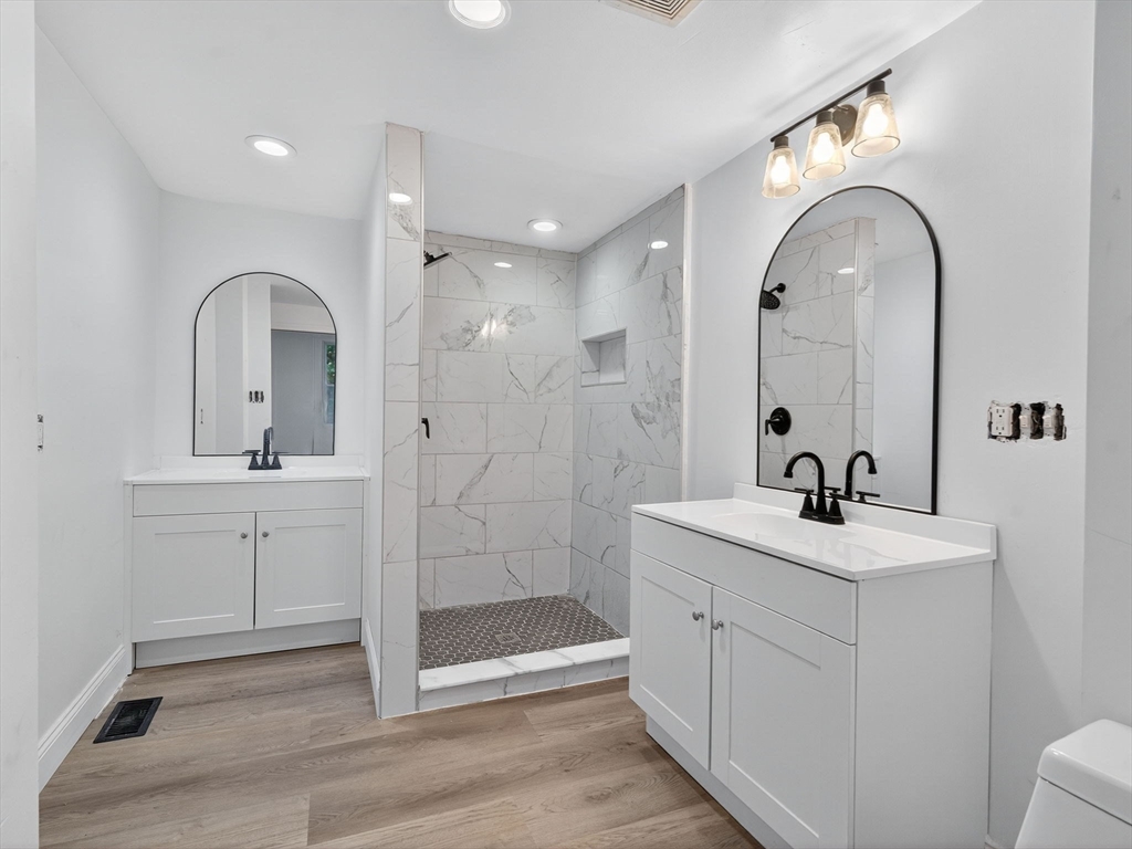 44 Liberty Street Randolph, MA 02368 - Photo 8 of 41 a bathroom with a double vanity sink mirror and shower