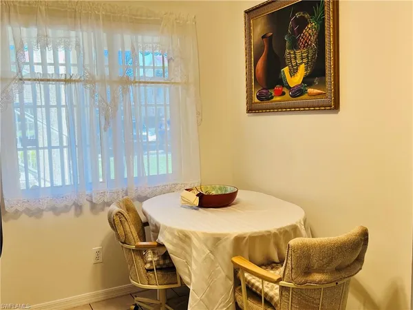 a dining room with a table and chairs