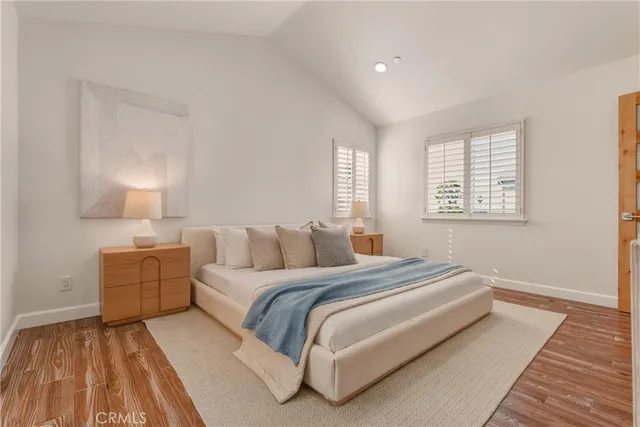 a bedroom with a bed and a night lamp