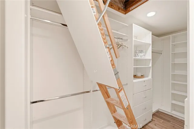 a view of staircase with white walls and a window