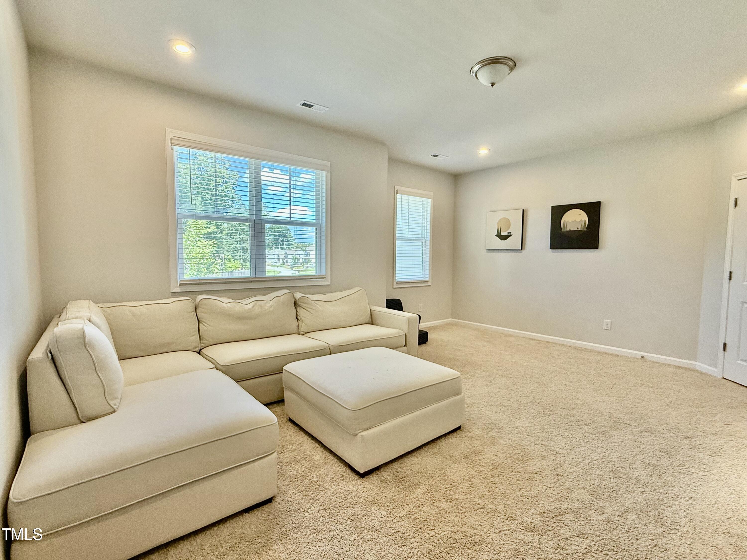8600 Deep Elm Drive Wake Forest, NC 27587 - Photo 11 of 21 a living room with furniture and a window