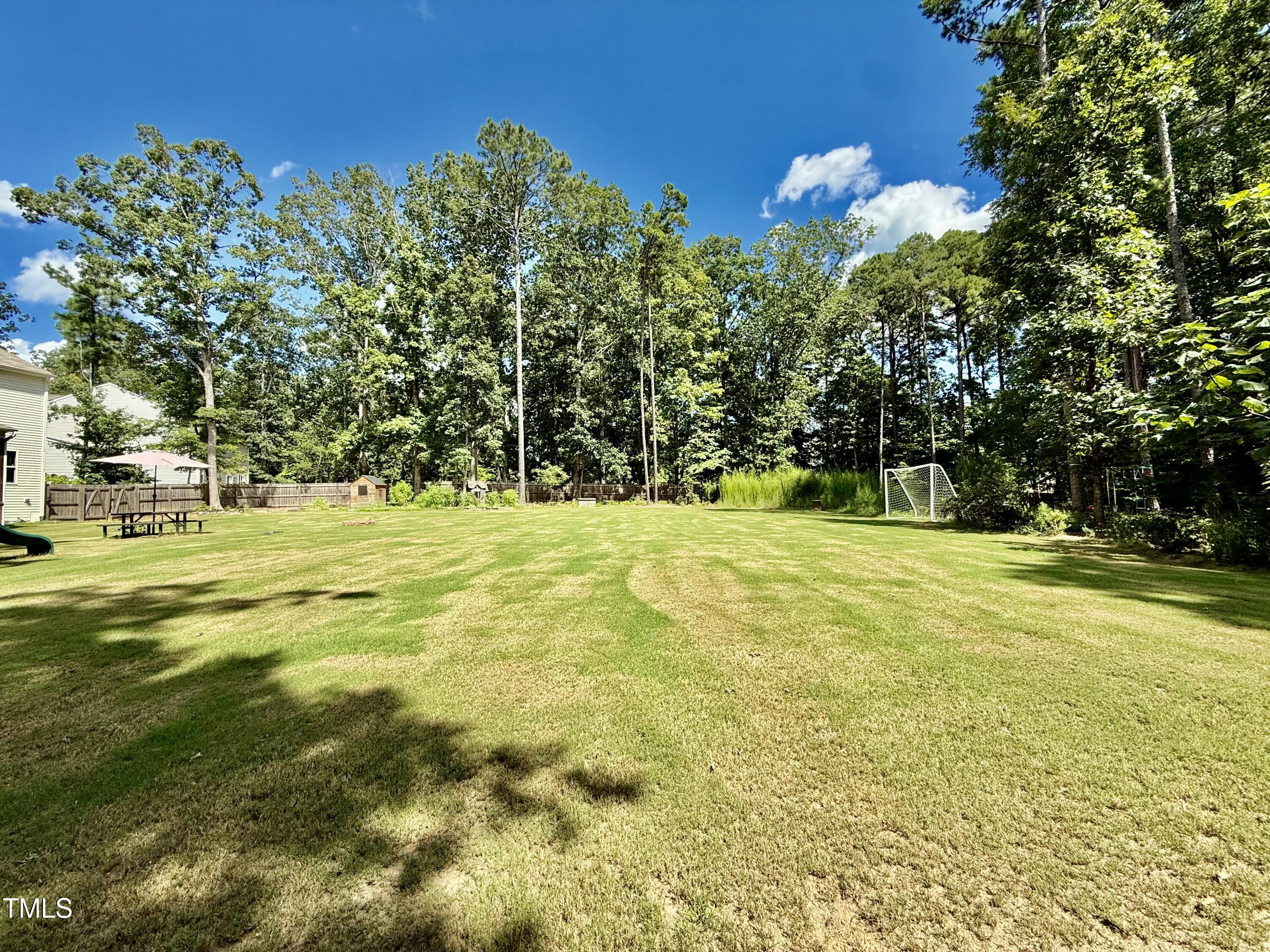 8600 Deep Elm Drive Wake Forest, NC 27587 - Photo 19 of 21 a view of swimming pool with an outdoor space and seating area