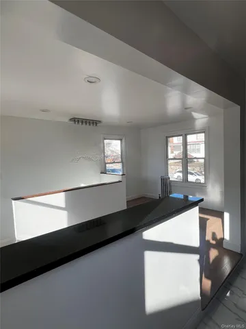 a view of a hallway with windows