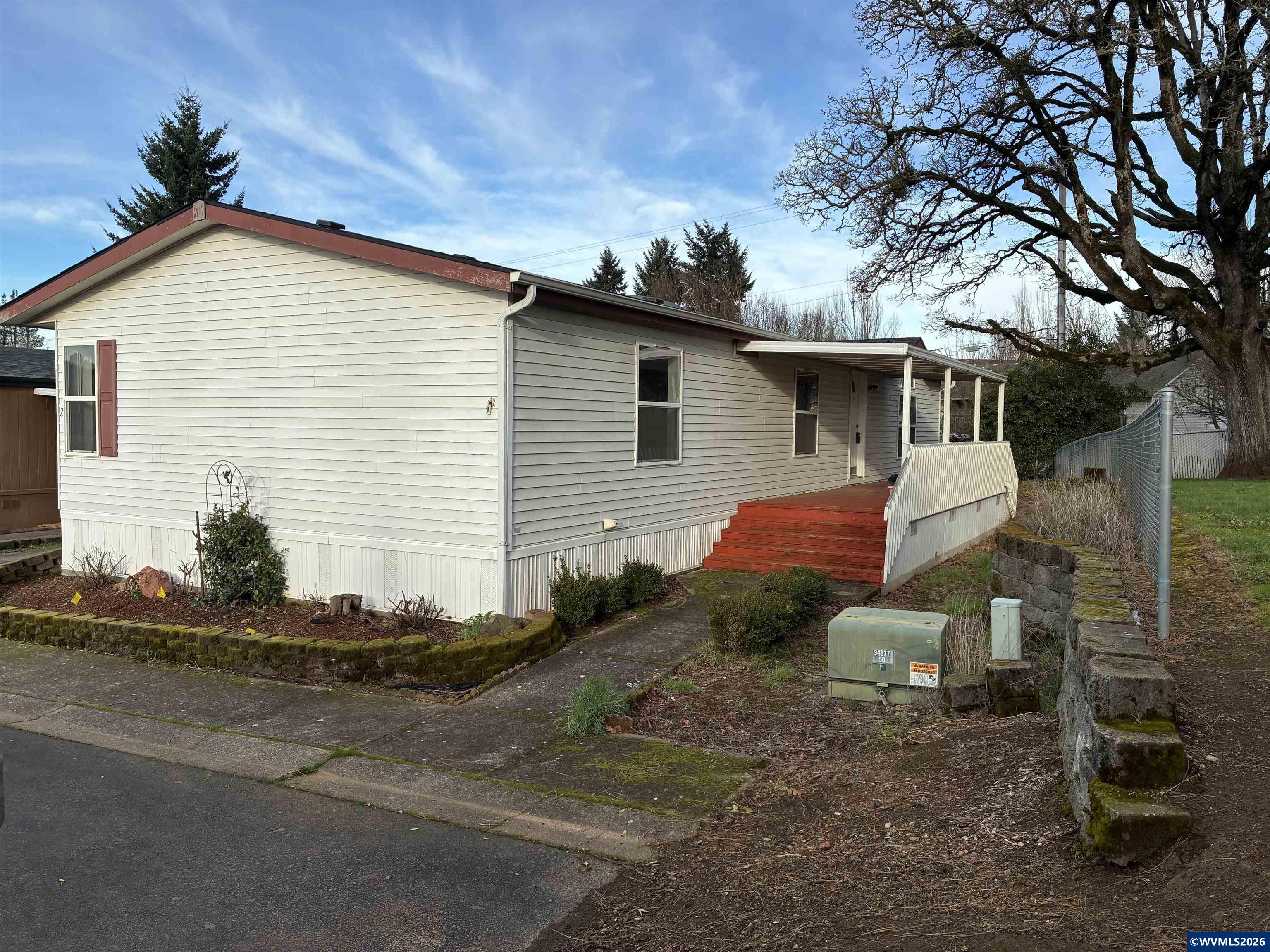 2000 Robins Lane Southeast, Unit 7 Salem, OR 97306 - Photo 1 of 39 a front view of a house with a yard