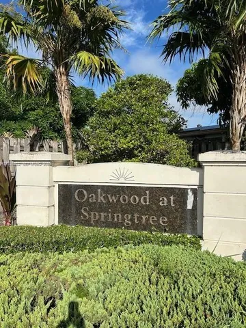 a street sign that is sitting in front of a building
