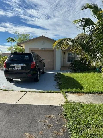a view of a car parked in back of a building
