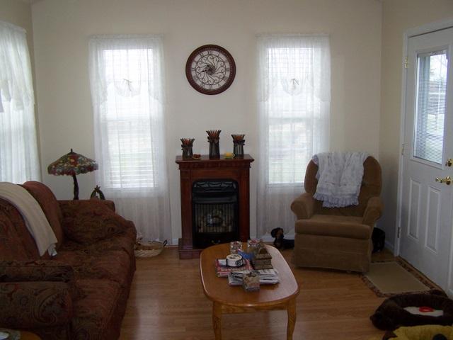 370 Comer Road Morrison, TN 37357 - Photo 10 of 17 a living room with furniture a fireplace and a window