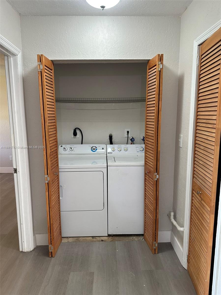 3611 Northwest 194th Terrace Miami Gardens, FL 33056 - Photo 5 of 15 a utility room with dryer and washer