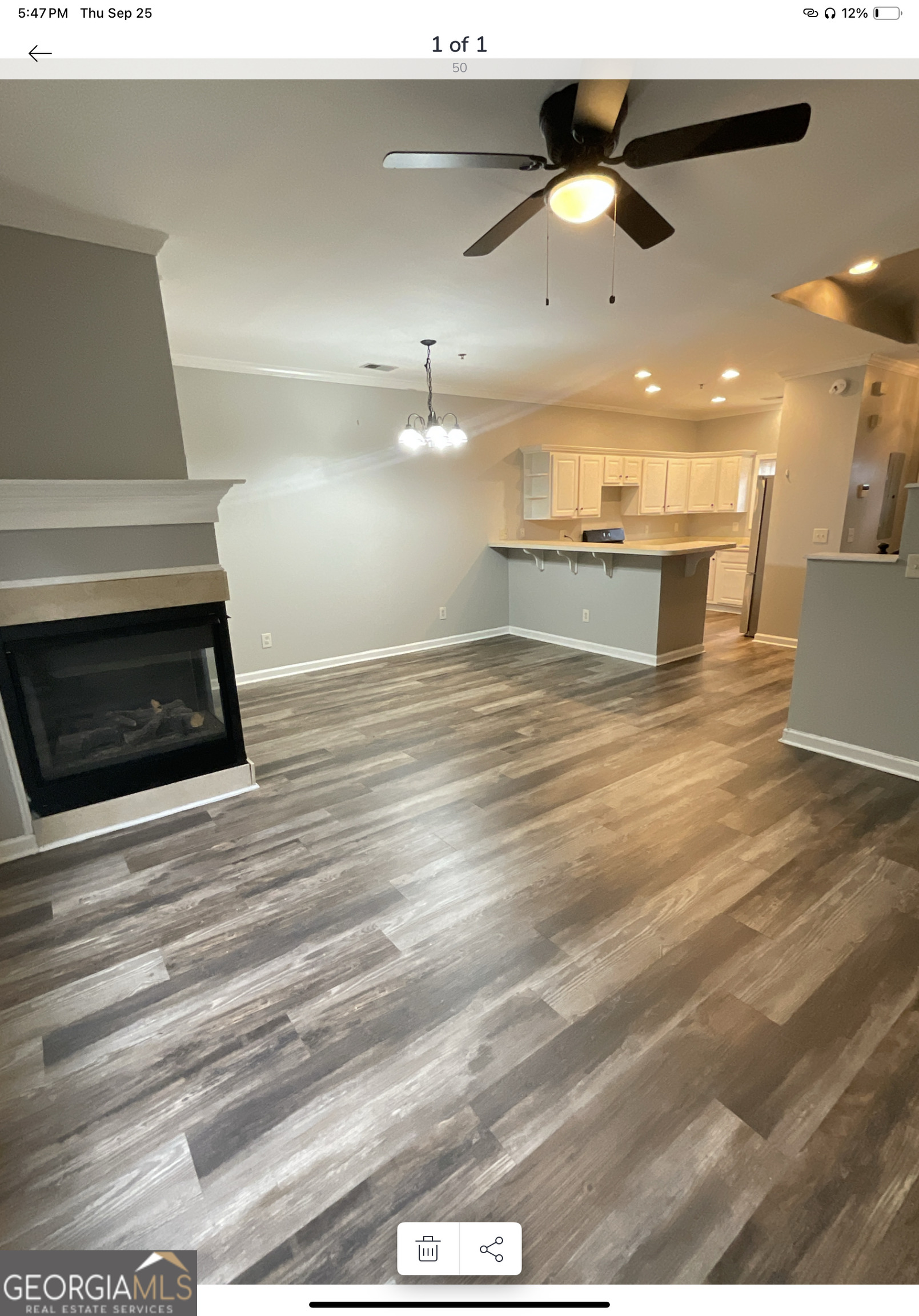 4222 Quailbrook Court Tucker, GA 30084 - Photo 3 of 19 a view of kitchen and empty room with wooden floor
