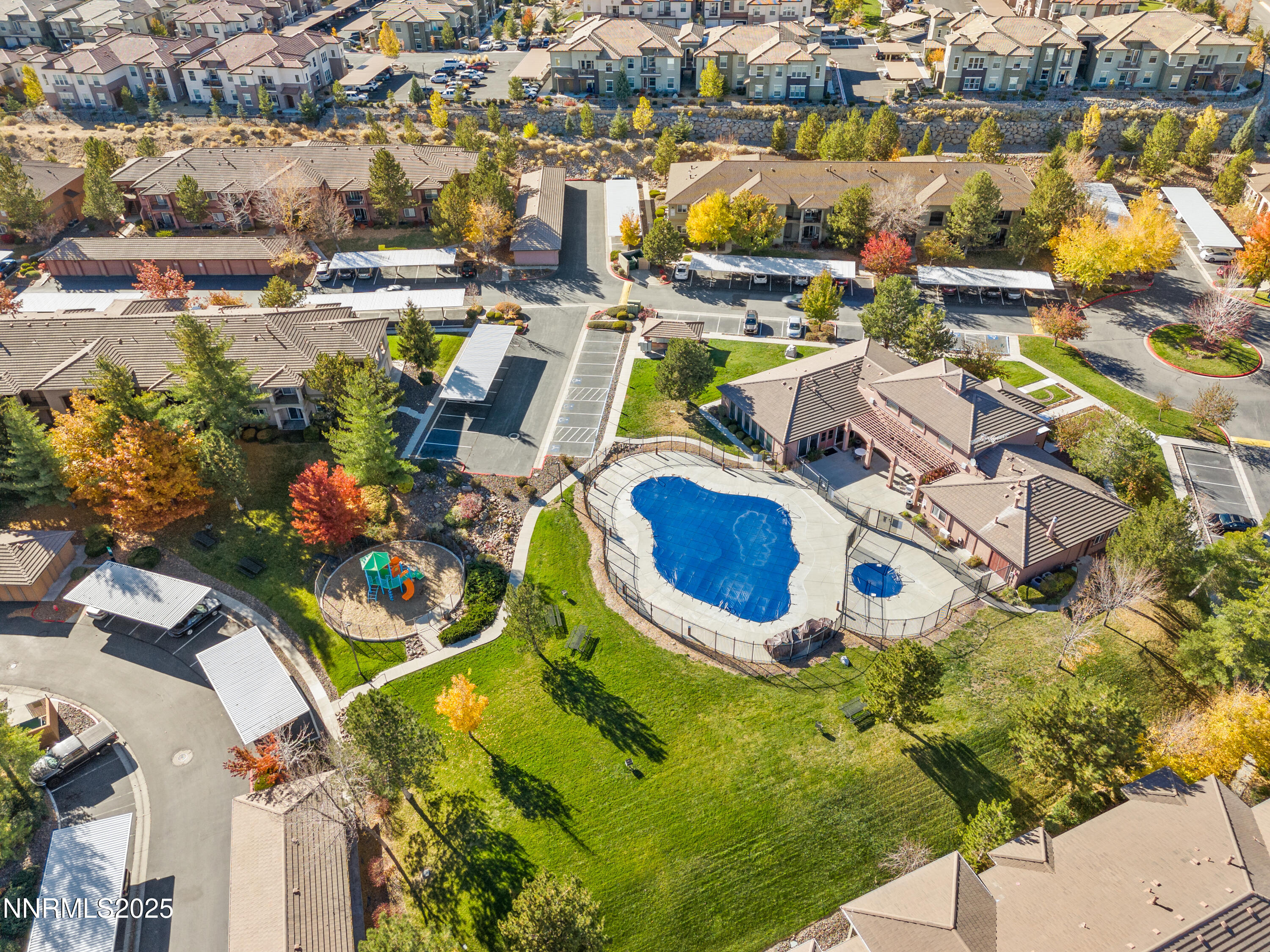 an aerial view of residential houses with outdoor space