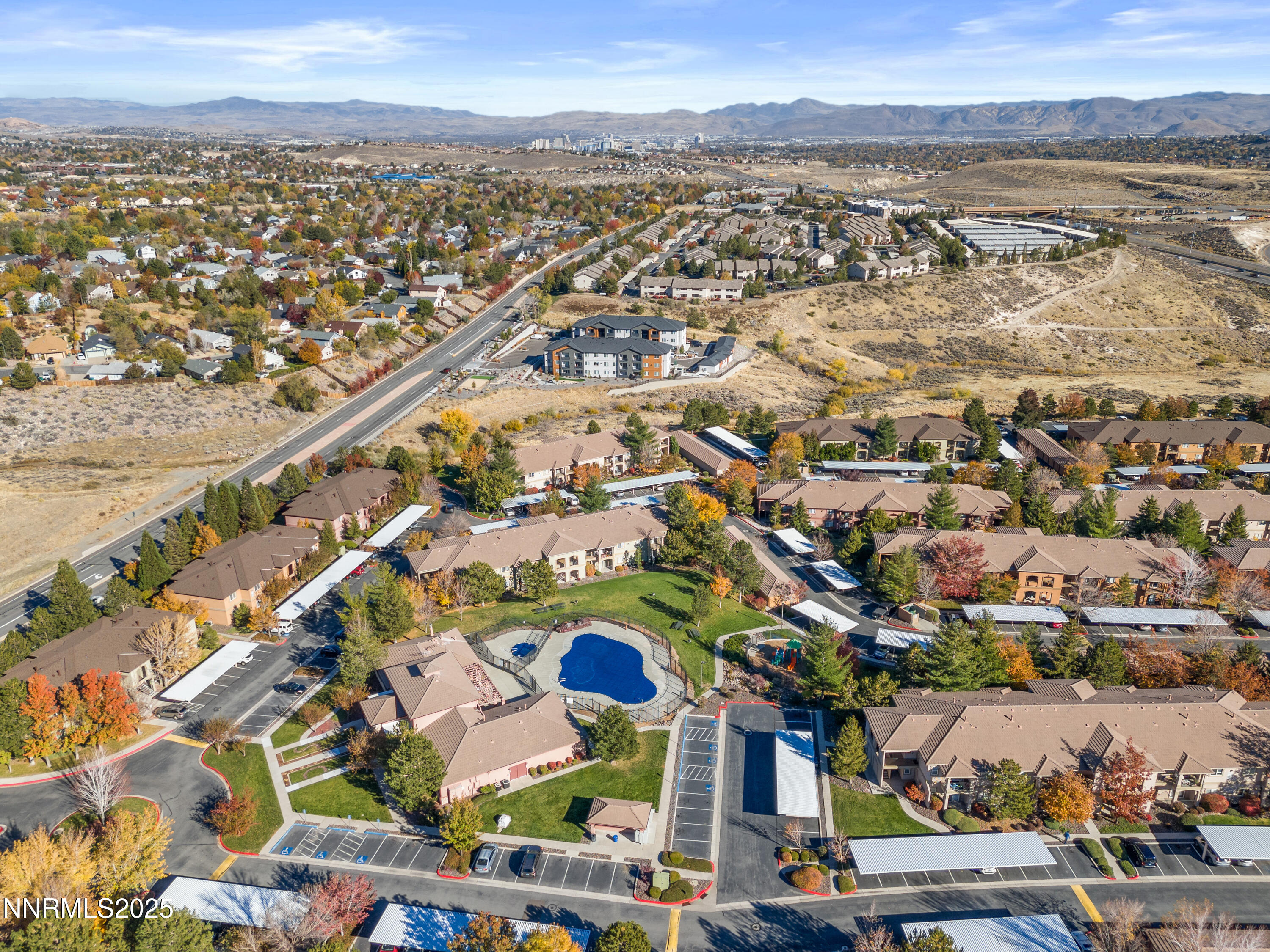 6850 Sharlands Avenue, Unit E1019 Reno, NV 89523 - Photo 2 of 5 an aerial view of residential building and lake view