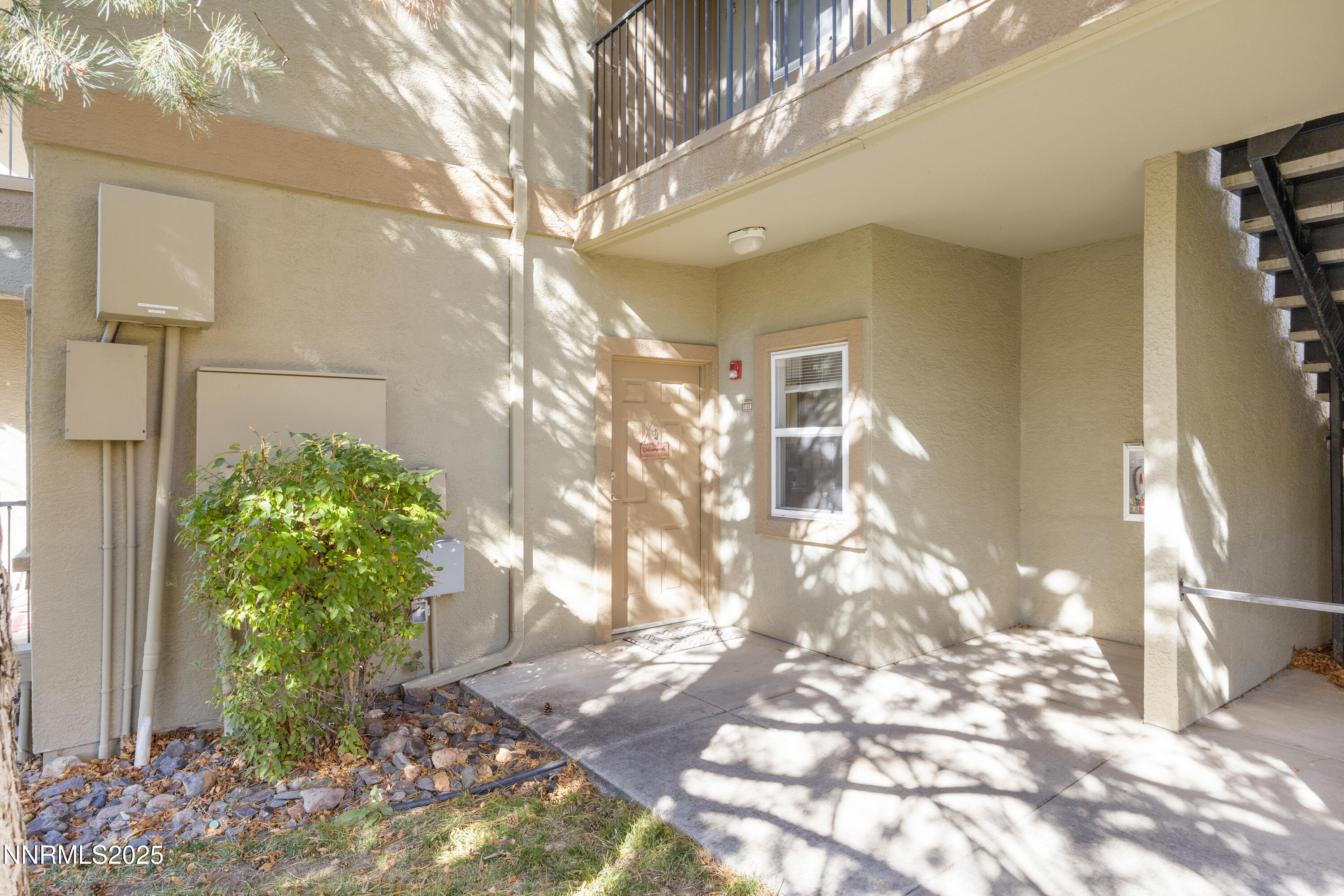 6850 Sharlands Avenue, Unit E1019 Reno, NV 89523 - Photo 3 of 5 a view of a pathway in a yard