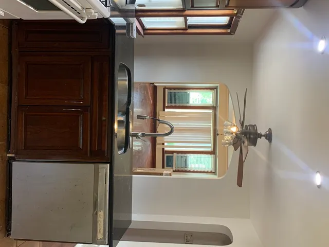 a kitchen with granite countertop stainless steel appliances and cabinets