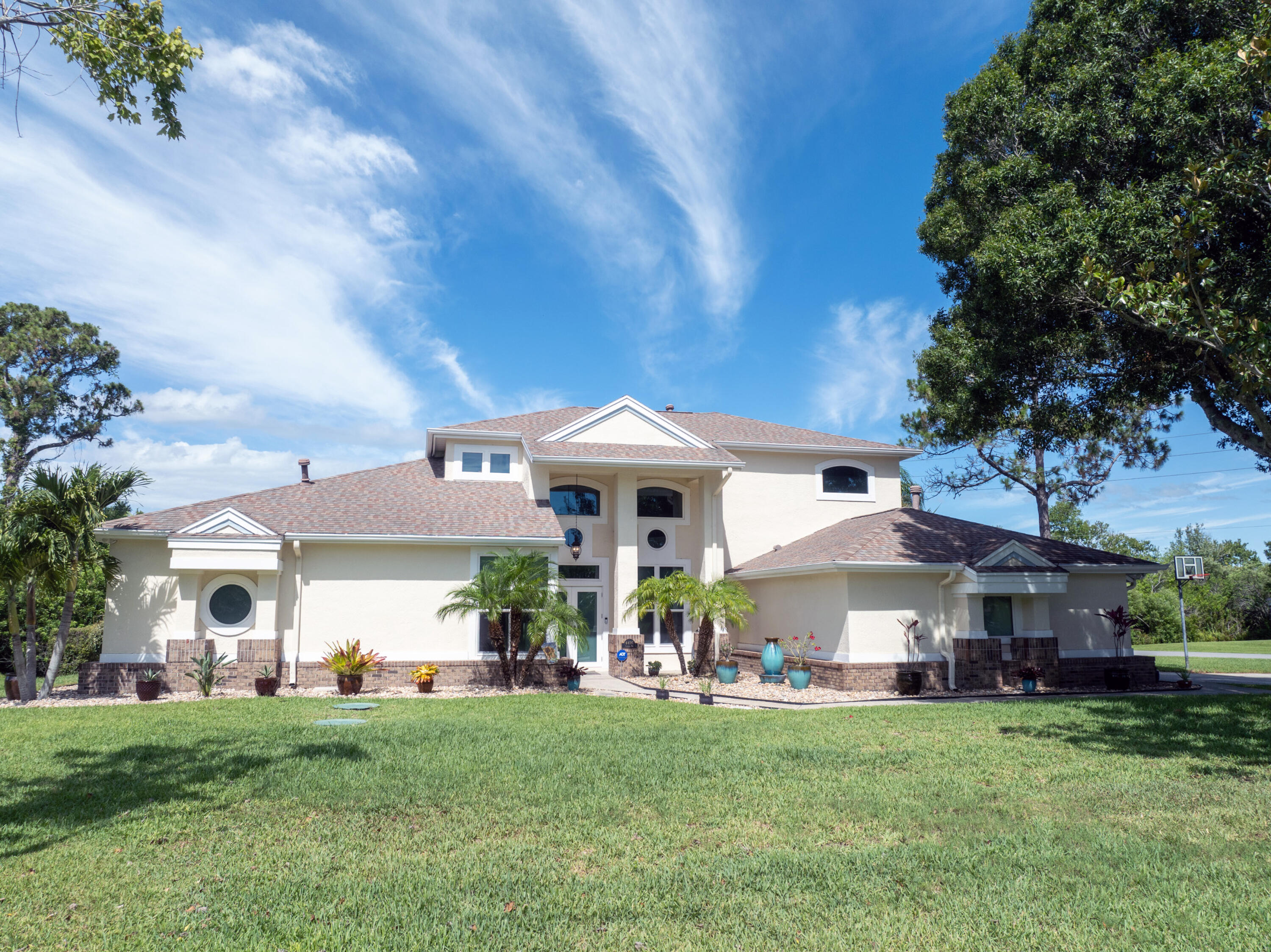 4490 Canard Road Melbourne, FL 32934 - Photo 45 of 52 a view of a house with a garden