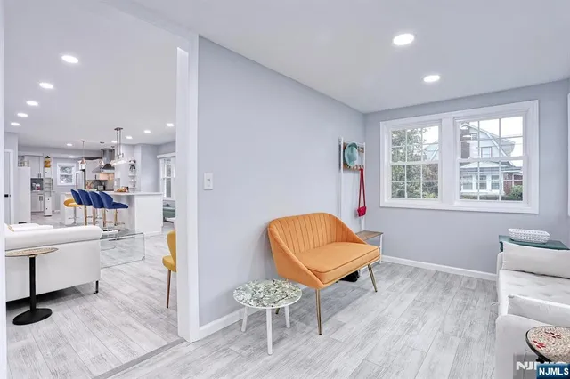 a living room with furniture and a chair