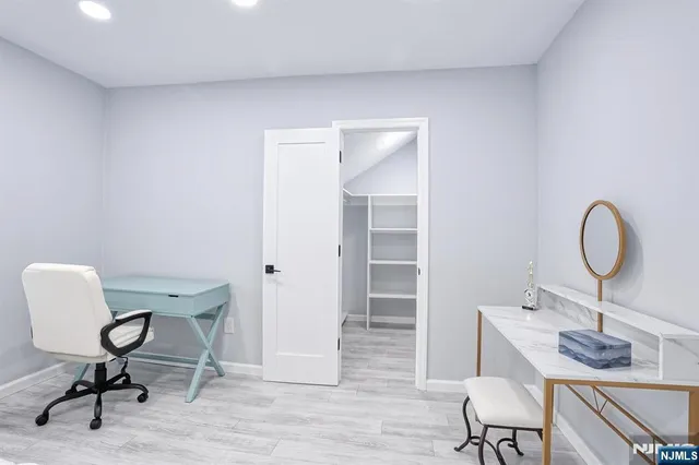 a view of a workspace with furniture