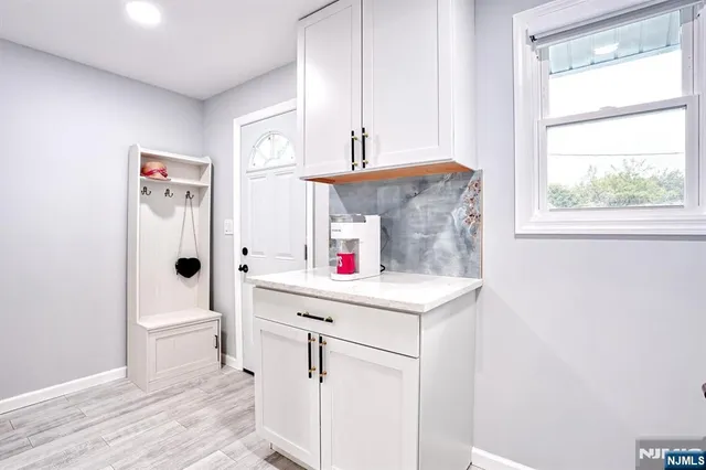 a utility room with a sink a washer and dryer